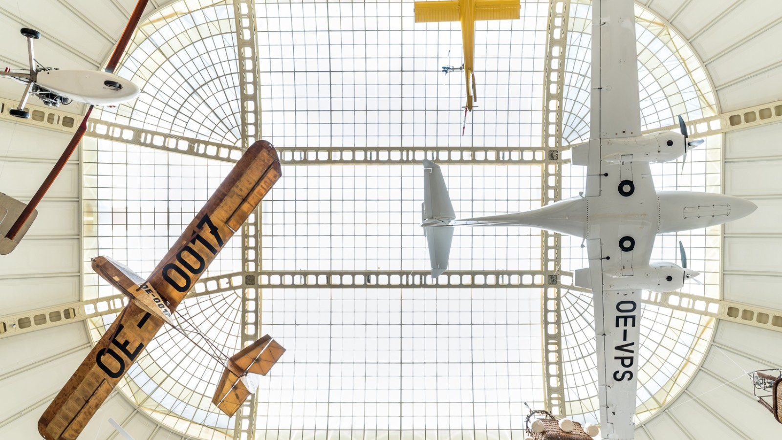 Airplanes hanging under the museum roof, part of the exhibition „In Motion": 