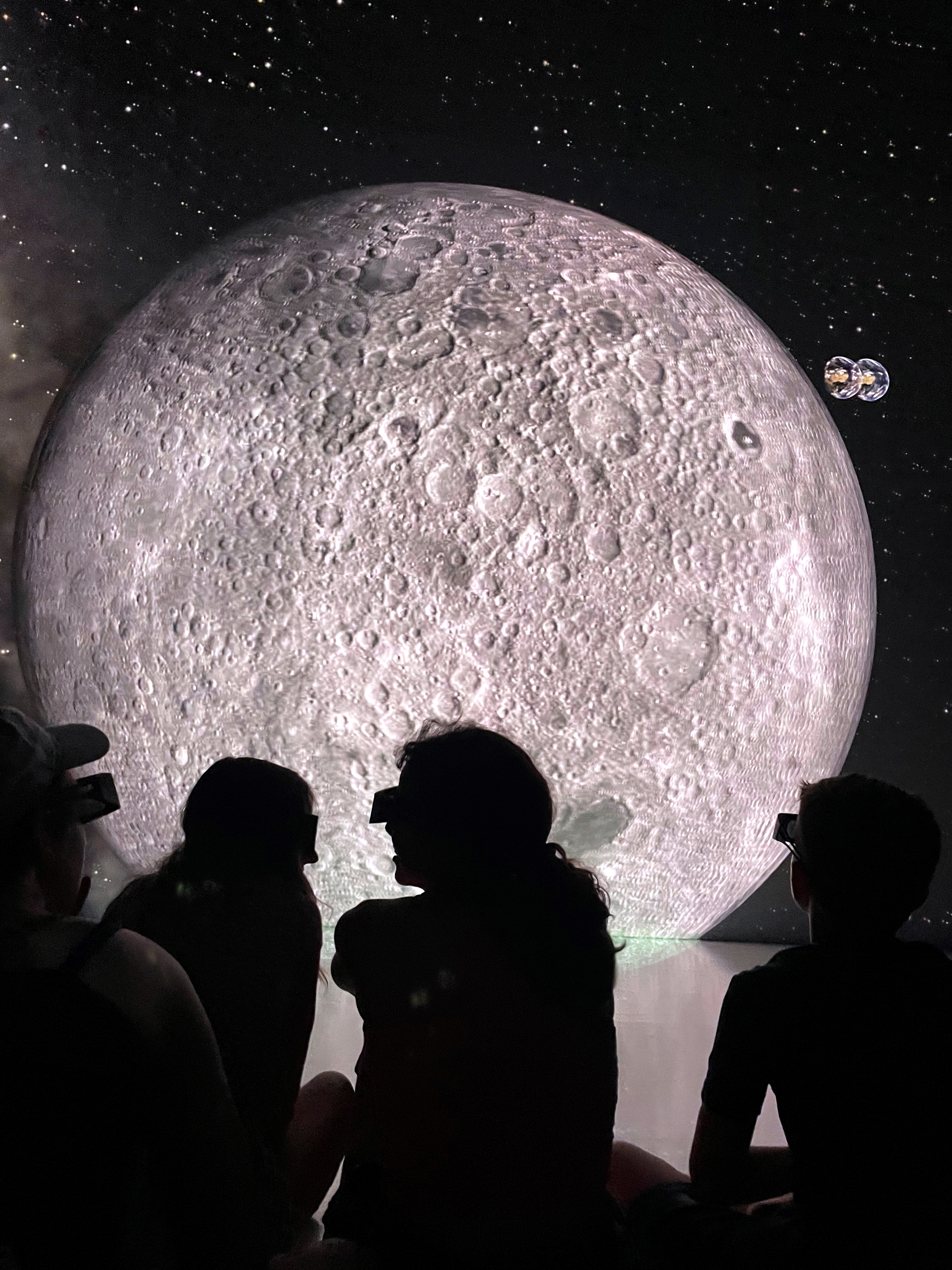 Who wouldn't want to see the moon up close? 
With 3D glasses, this is possible in Deep Space 8K.